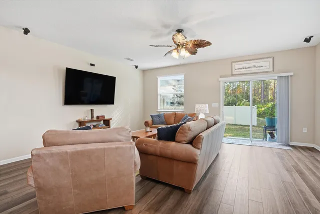a view of a living room with hardwood floor