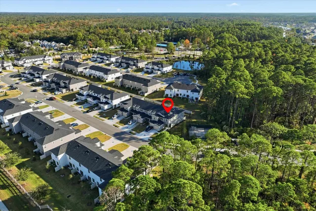 a aerial view of a house with a big yard