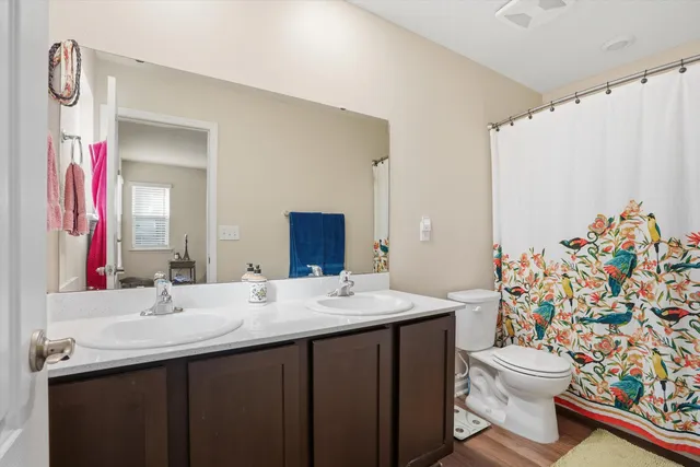 a room with a table chairs and wooden floor