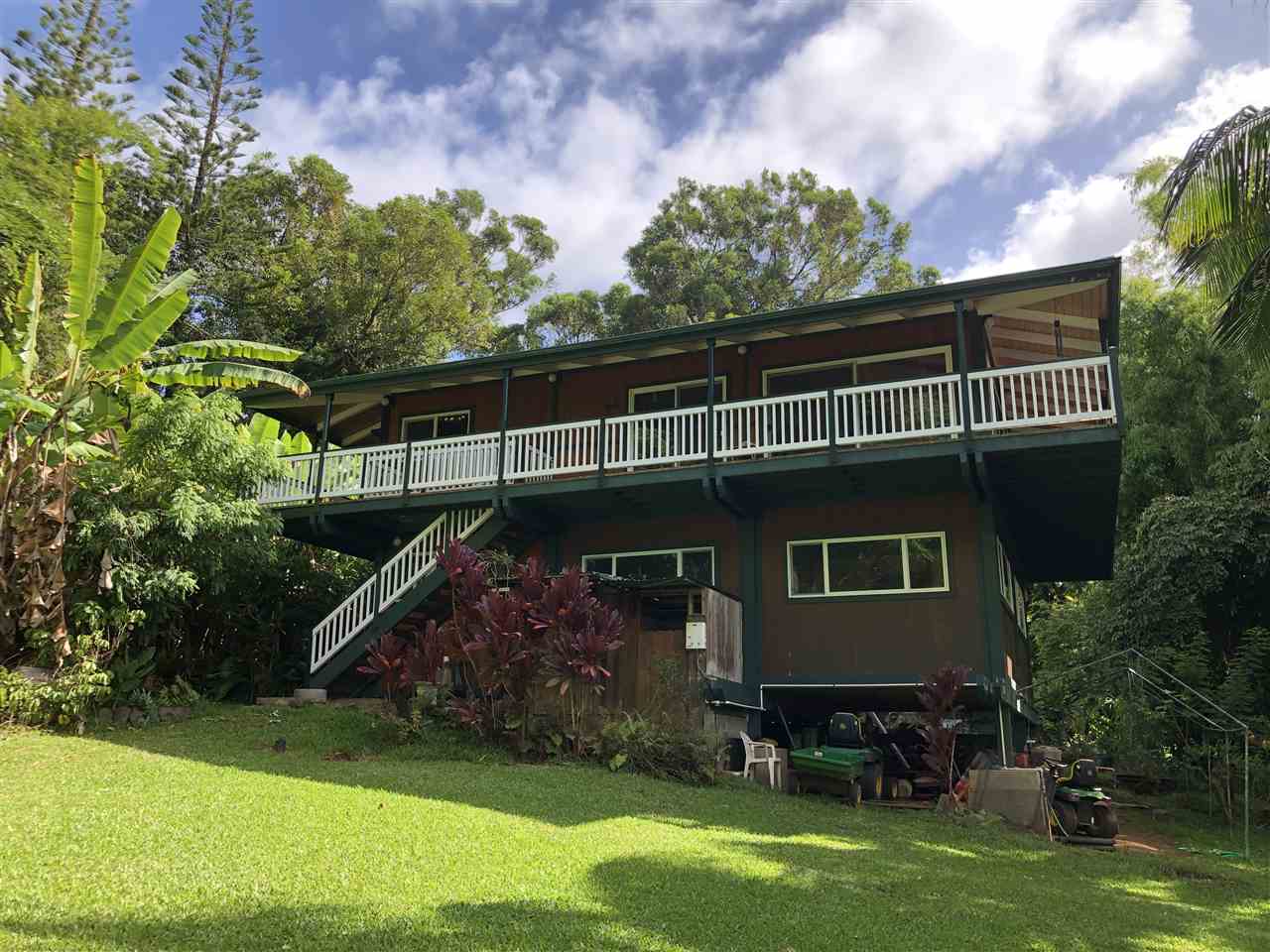 19 Door Of Faith Road Haiku, HI 96708 - Photo 1 of 30 a backyard of a house with lots of green space