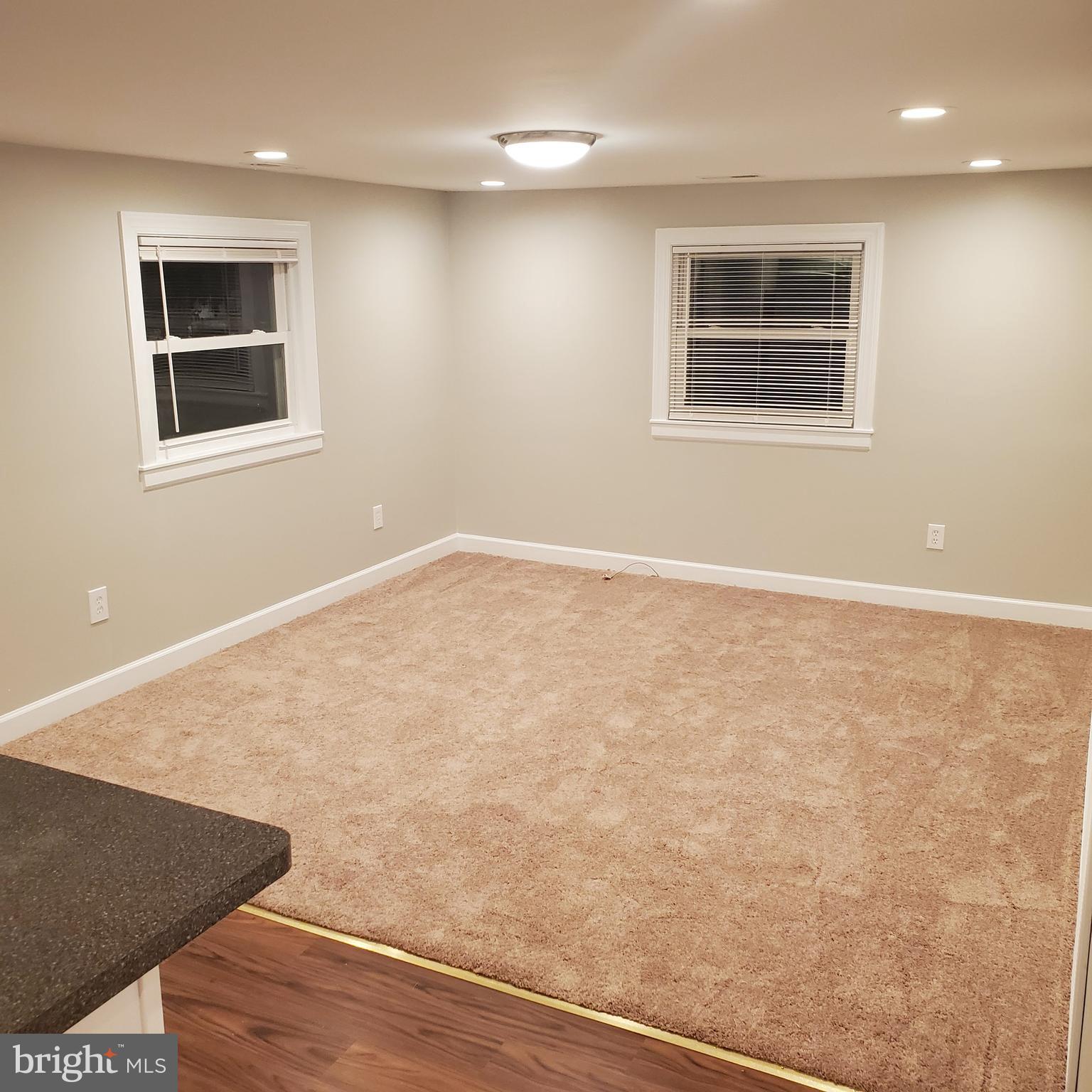 278 Ridge Road Browns Mills, NJ 08015 - Photo 12 of 22 a view of an empty room with wooden floor and a window