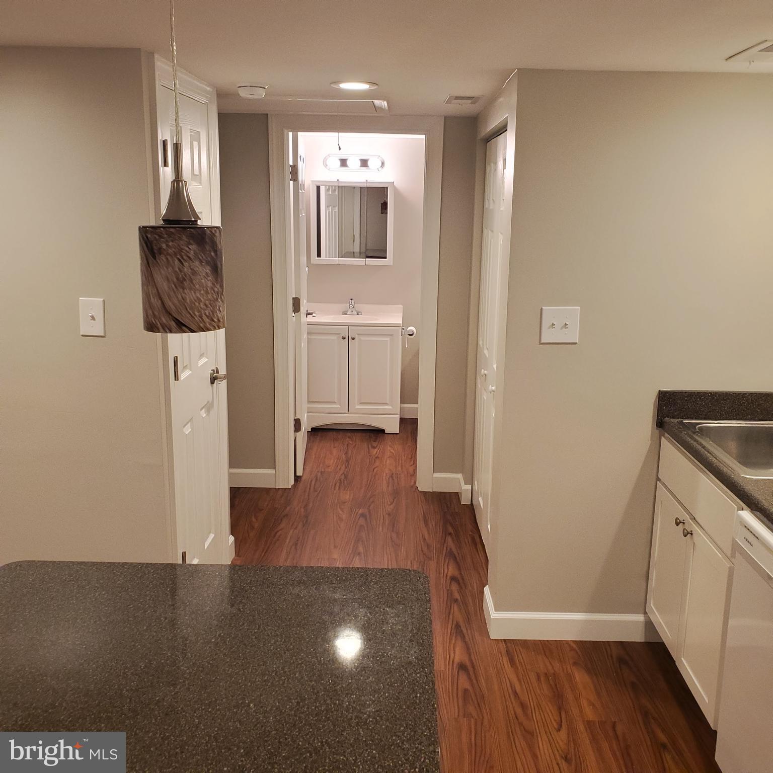 278 Ridge Road Browns Mills, NJ 08015 - Photo 13 of 22 a hallway with a wooden floor a washer and dryer