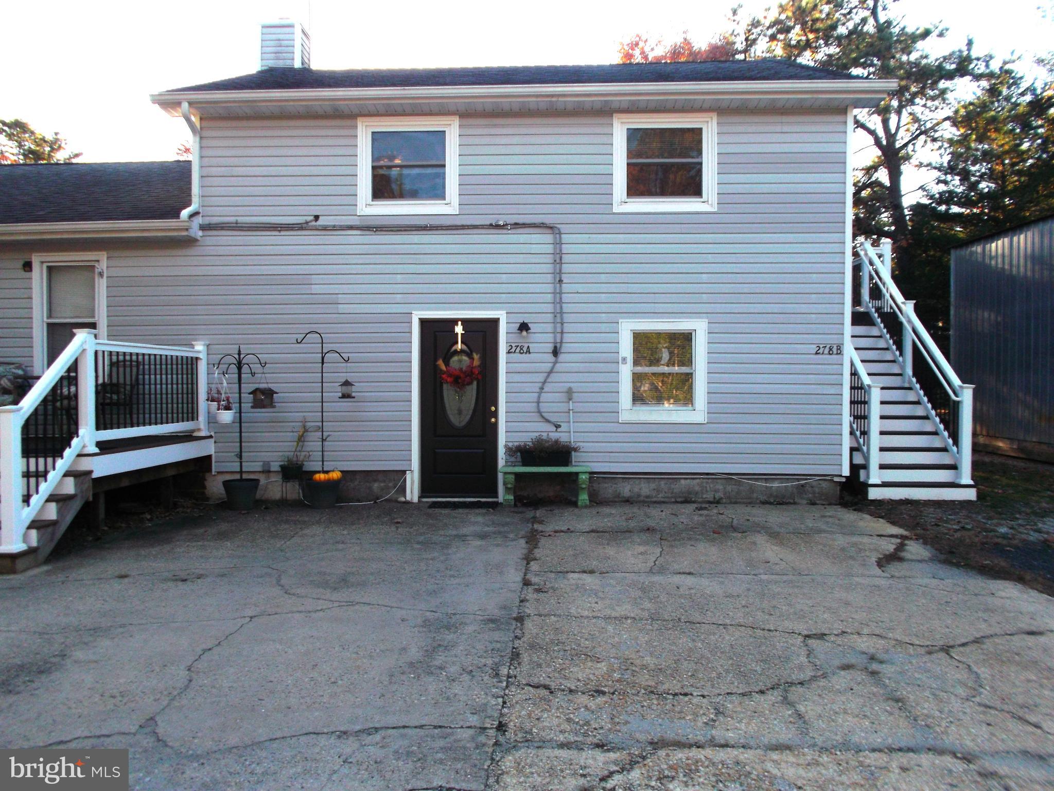 278 Ridge Road Browns Mills, NJ 08015 - Photo 20 of 22 a view of a house with a yard and garage