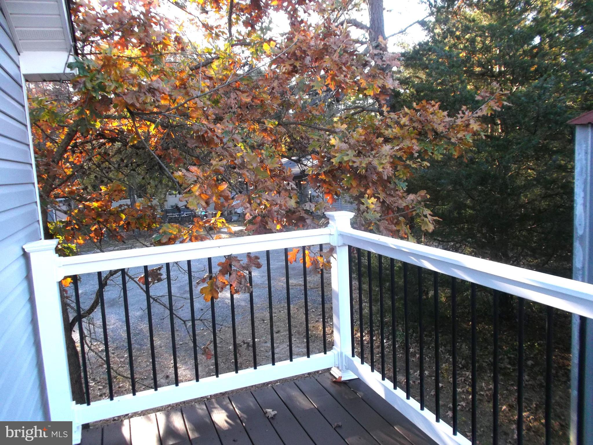 278 Ridge Road Browns Mills, NJ 08015 - Photo 22 of 22 a balcony with wooden floor