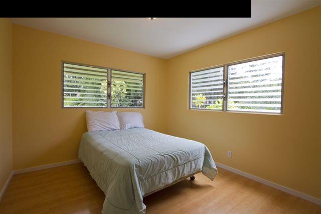 40 Kapuai Road Haiku, HI 96708 - Photo 13 of 29 a bedroom with a bed and a window