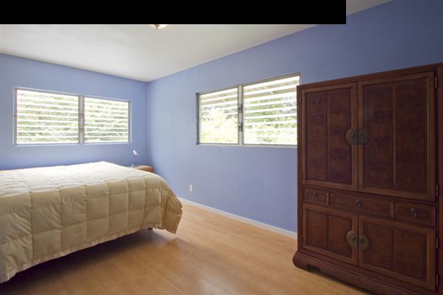 40 Kapuai Road Haiku, HI 96708 - Photo 15 of 29 a bed sitting in a bedroom next to a window