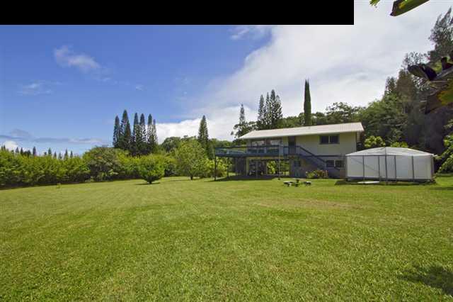 40 Kapuai Road Haiku, HI 96708 - Photo 2 of 29 a front view of a house with a garden and yard