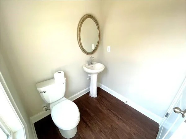 a bathroom with a toilet and a sink
