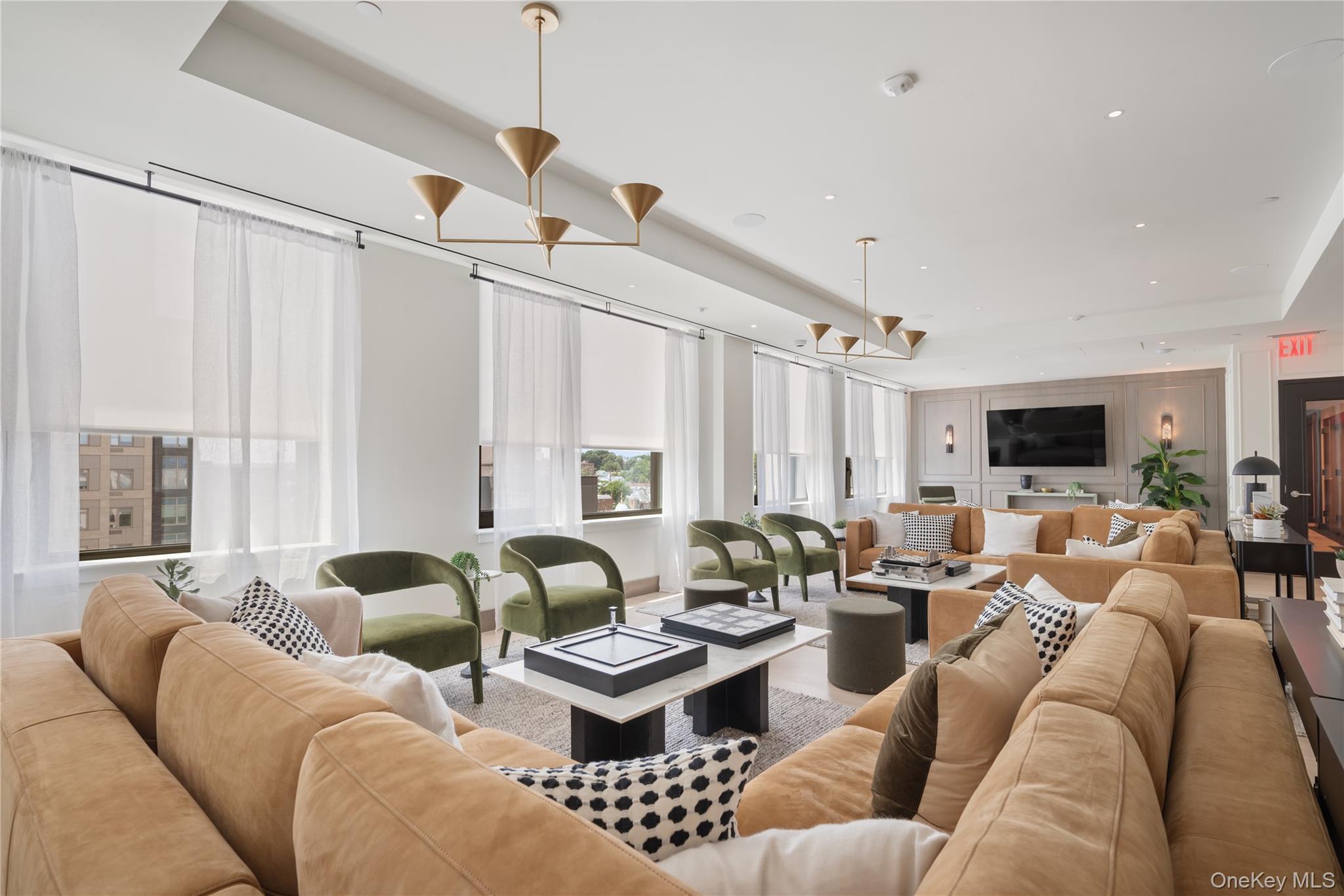 103 88th Avenue Queens, NY 11432 - Photo 18 of 29 a living room with furniture and a large window