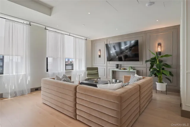 a view of a livingroom with furniture wooden floor and a rug