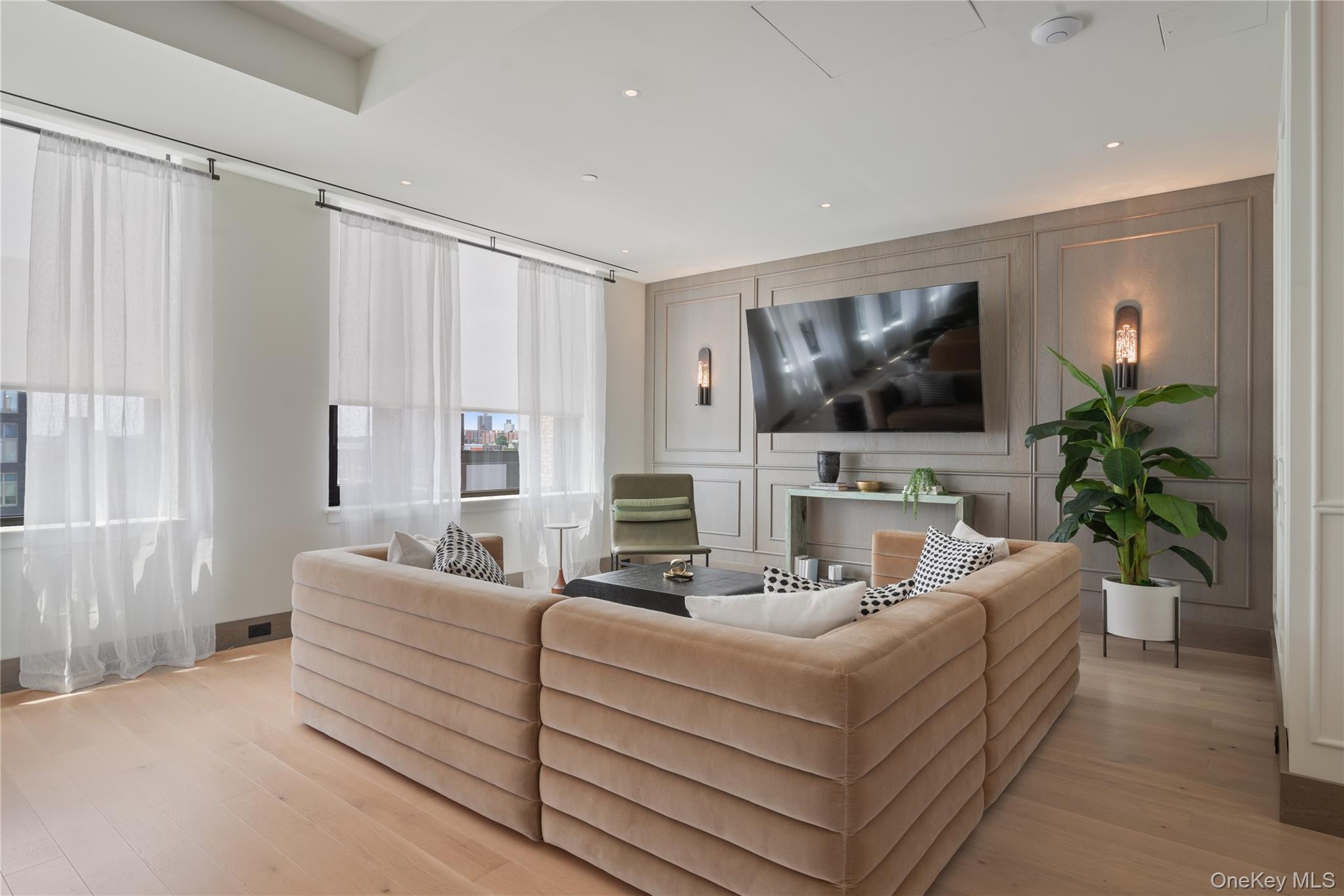 103 88th Avenue Queens, NY 11432 - Photo 20 of 29 a living room with furniture and a flat screen tv