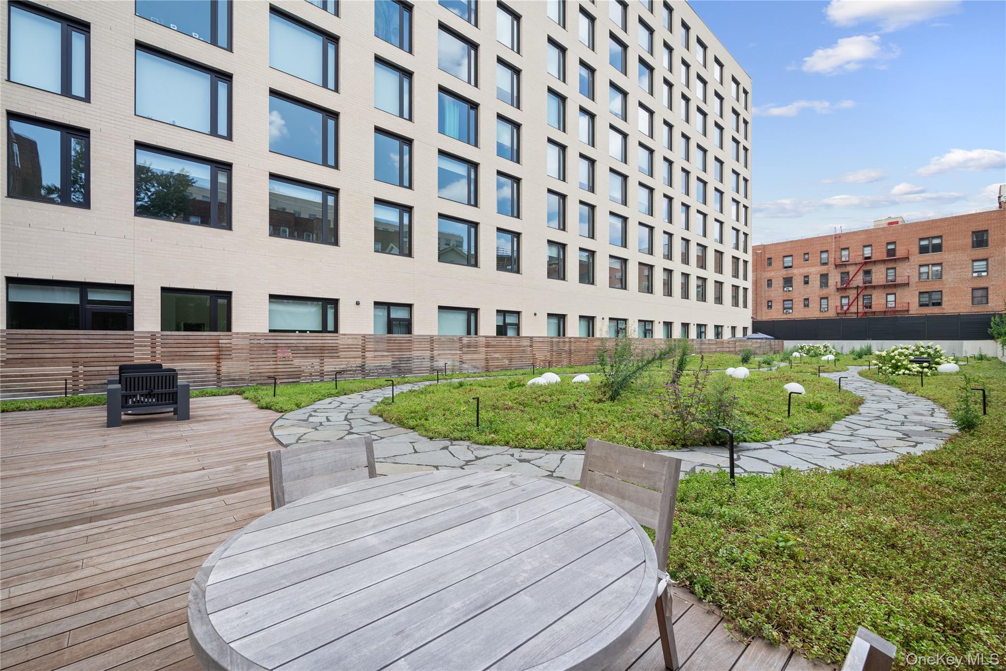 103 88th Avenue Queens, NY 11432 - Photo 27 of 29 a view of a building with garden and sitting area