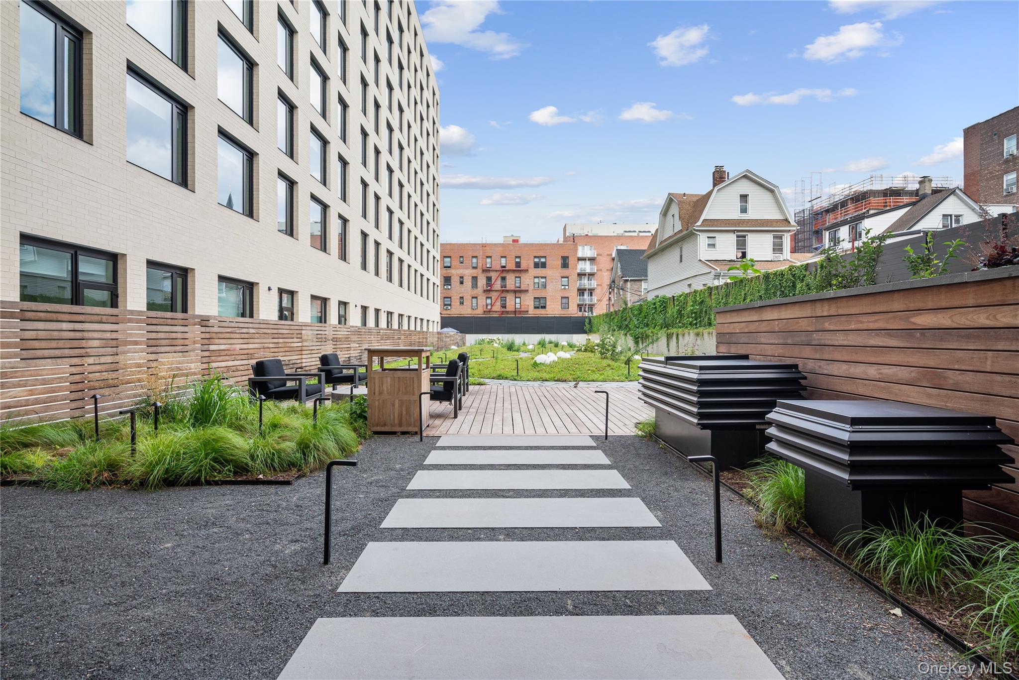 103 88th Avenue Queens, NY 11432 - Photo 28 of 29 a view of a building with a garden