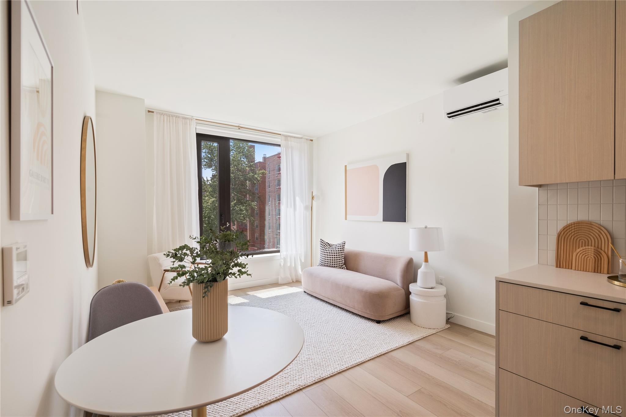 103 88th Avenue Queens, NY 11432 - Photo 3 of 29 a living room with furniture flowerpot and window