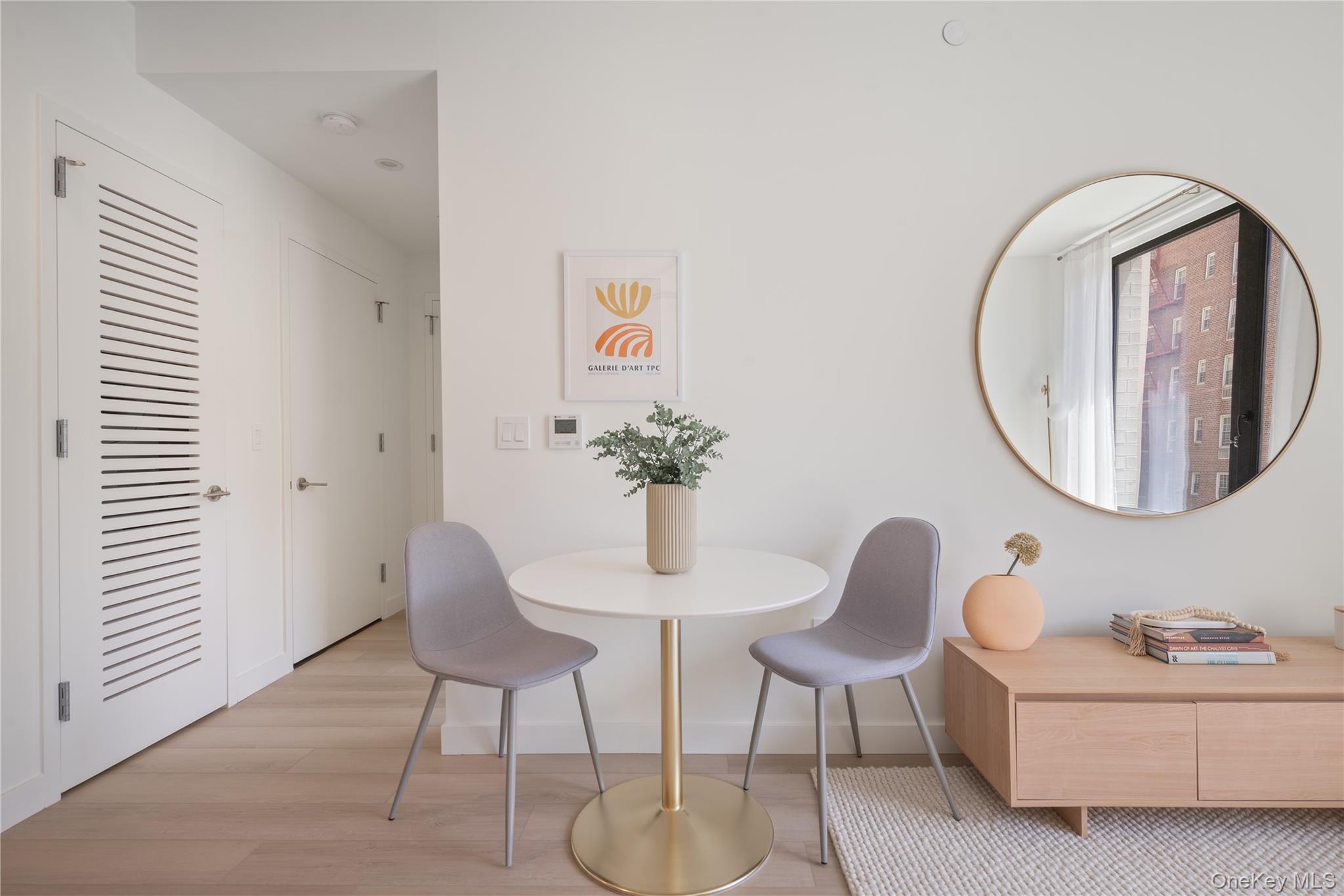 103 88th Avenue Queens, NY 11432 - Photo 5 of 29 a dining room with furniture and a mirror