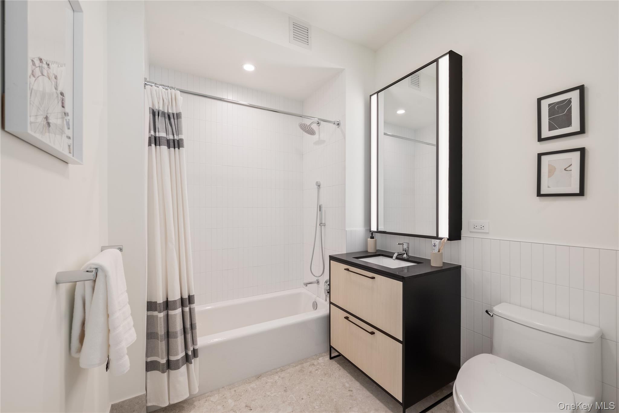 103 88th Avenue Queens, NY 11432 - Photo 9 of 29 a bathroom with a granite countertop sink toilet and shower