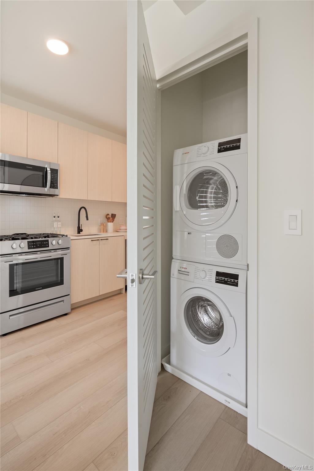 103 88th Avenue Queens, NY 11432 - Photo 10 of 29 a utility room with sink dryer and washer