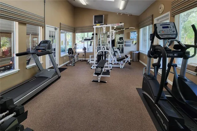 a view of swimming pool with outdoor seating and city view