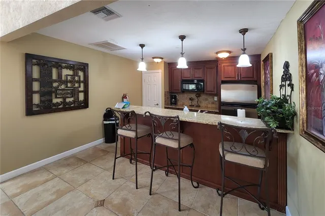 a view of a lake with lawn chairs