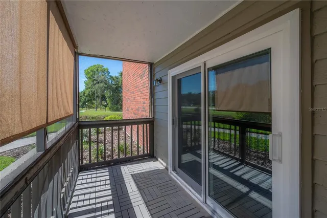 a view of balcony with floor to ceiling window