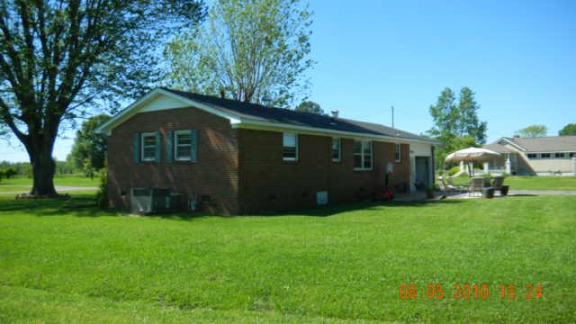 86 Sears Roebuck Road Tullahoma, TN 37388 - Photo 10 of 16 This is a view of the side/back of the home. The concrete driveway extends to the rear of the home with a turn-around area as well.