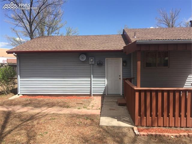 2441 Ranch Lane Colorado Springs, CO 80918 - Photo 21 of 24 Rear of Property/Back Door to 2 Car Garage