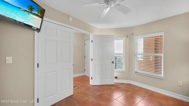 a bathroom with a granite countertop sink mirror vanity and toilet