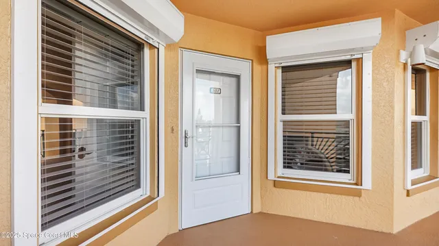 a view of a door and a window