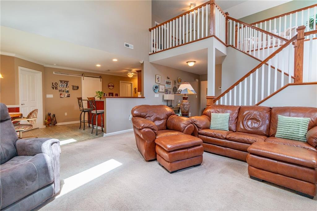 425 Chestnut Lane Apollo, PA 15613 - Photo 7 of 48 a living room with furniture ceiling fan and a rug