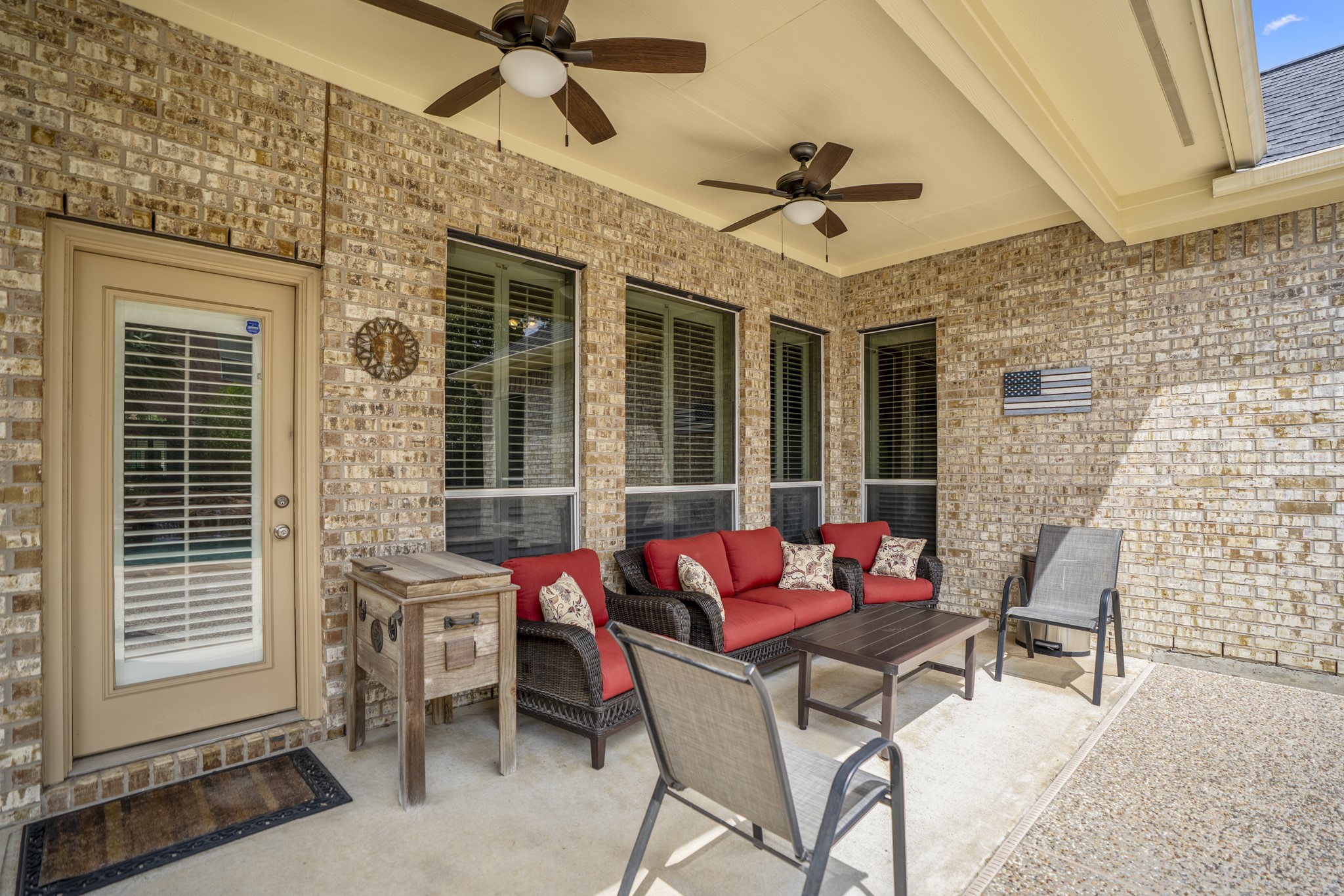 1438 Hatchmere Place Spring, TX 77379 - Photo 32 of 50 Step outdoors to a covered patio with outdoor fans and enjoy the summertime fun going on it your own backyard.