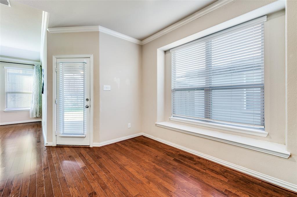 16008 Aquilla Way Prosper, TX 75078 - Photo 11 of 33 a view of an empty room with wooden floor and a window