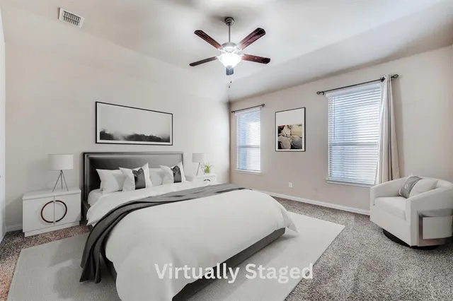 a bedroom with a bed and window