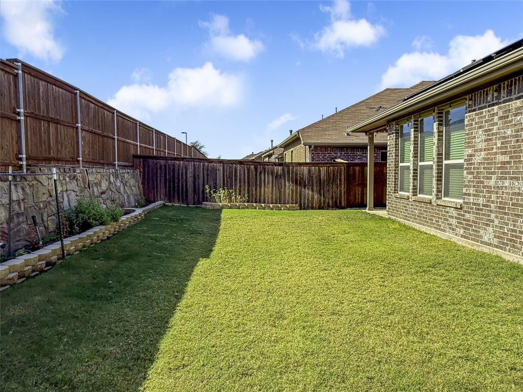 16008 Aquilla Way Prosper, TX 75078 - Photo 30 of 33 a view of a backyard with a garden