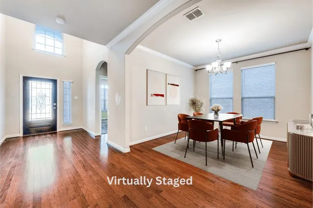 a view of a livingroom with furniture window and wooden floor
