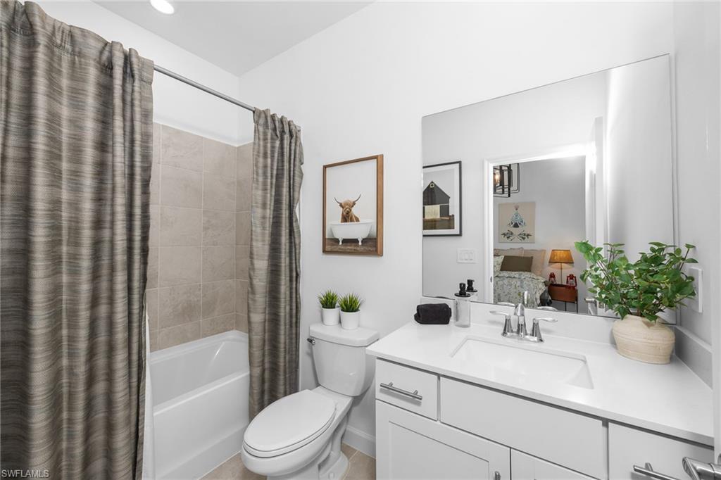 17752 Saddleback Loop North Fort Myers, FL 33917 - Photo 25 of 37 Full bath with vanity, shower / tub combo, and ensuite bathroom