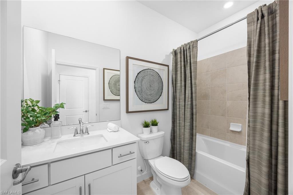 17752 Saddleback Loop North Fort Myers, FL 33917 - Photo 31 of 37 Full bathroom featuring vanity and shower / tub combo