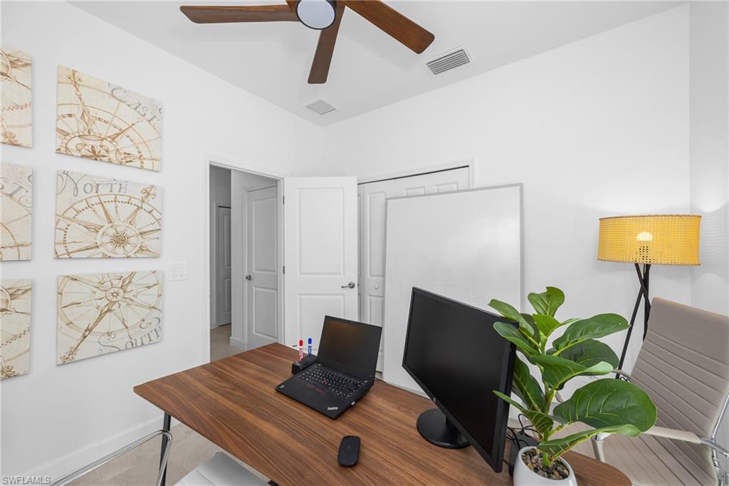 17752 Saddleback Loop North Fort Myers, FL 33917 - Photo 32 of 37 Tiled home office with ceiling fan and baseboards
