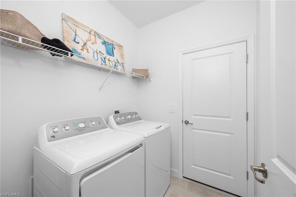 17752 Saddleback Loop North Fort Myers, FL 33917 - Photo 34 of 37 Washroom featuring washing machine and clothes dryer