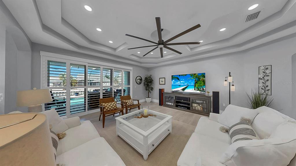 701 Pinckney Drive Apollo Beach, FL 33572 - Photo 14 of 99 a living room with furniture and a flat screen tv