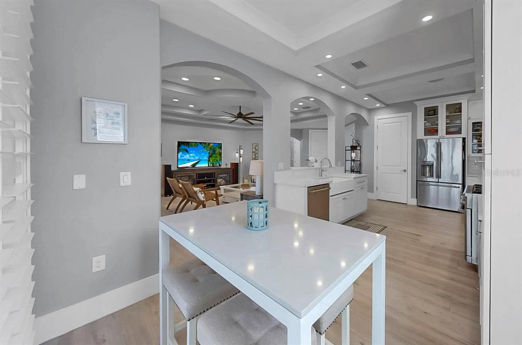 701 Pinckney Drive Apollo Beach, FL 33572 - Photo 24 of 99 a view of a dining room with furniture and wooden floor