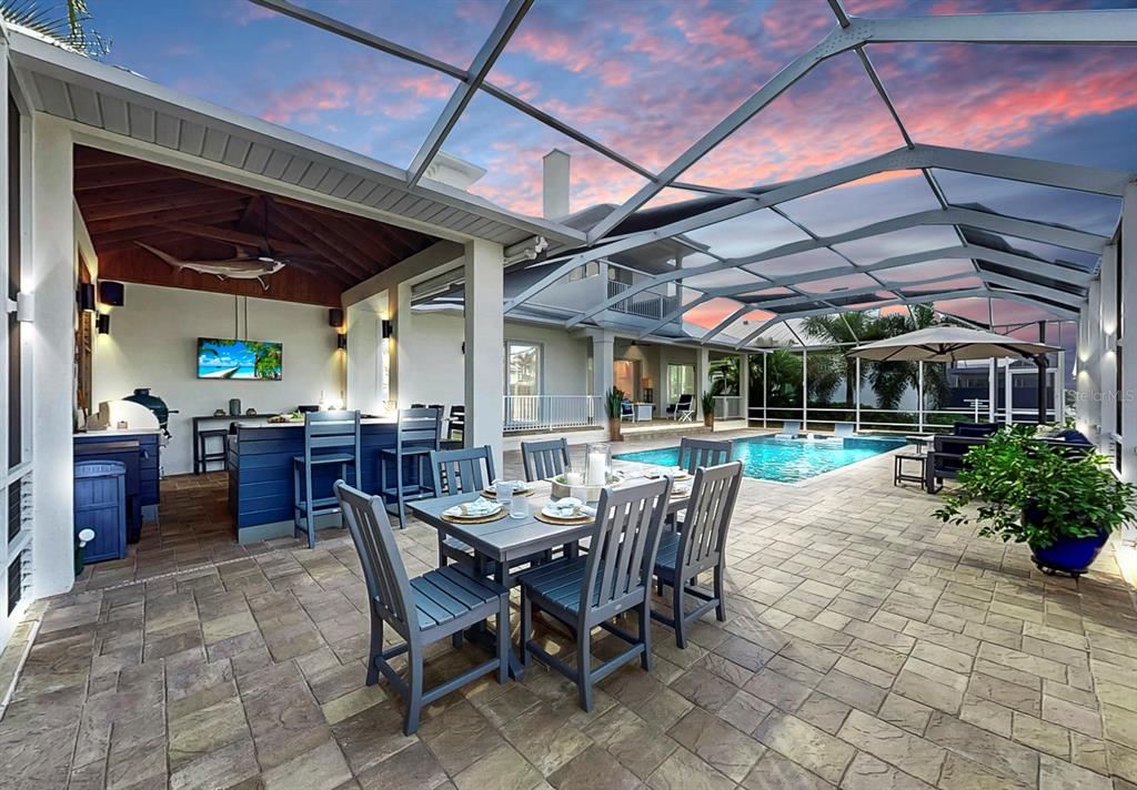 701 Pinckney Drive Apollo Beach, FL 33572 - Photo 3 of 99 a view of a patio with table and chairs and potted plants