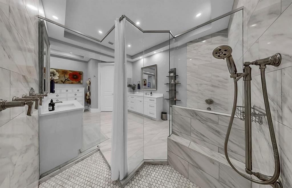701 Pinckney Drive Apollo Beach, FL 33572 - Photo 33 of 99 a bathroom with a sink a toilet and shower