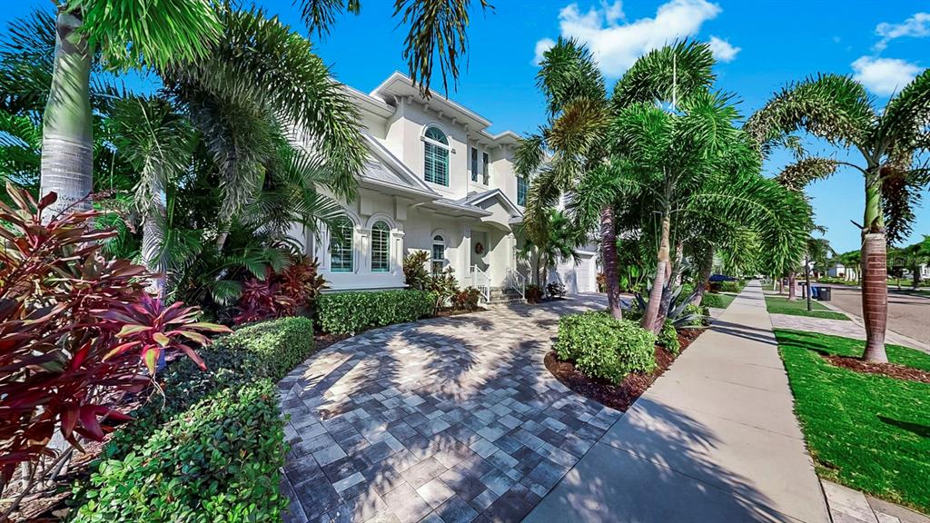 701 Pinckney Drive Apollo Beach, FL 33572 - Photo 5 of 99 a front view of a house with a yard and fountain