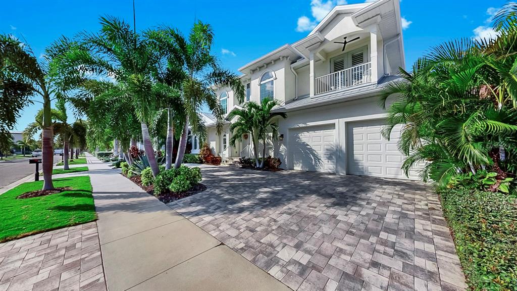 701 Pinckney Drive Apollo Beach, FL 33572 - Photo 5 of 99 a front view of a house with a yard and a garage