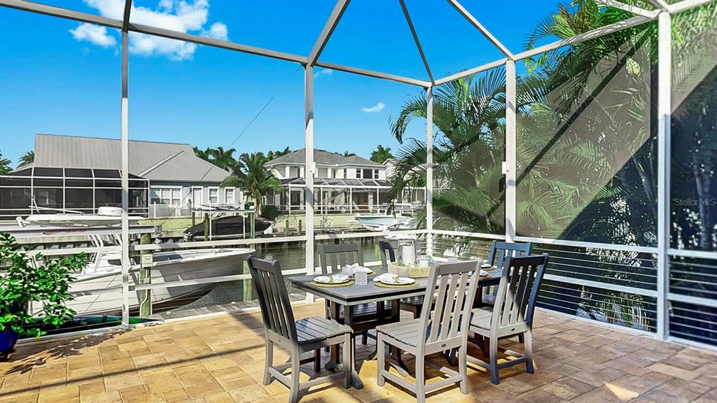 701 Pinckney Drive Apollo Beach, FL 33572 - Photo 55 of 99 a patio with glass top table and chairs