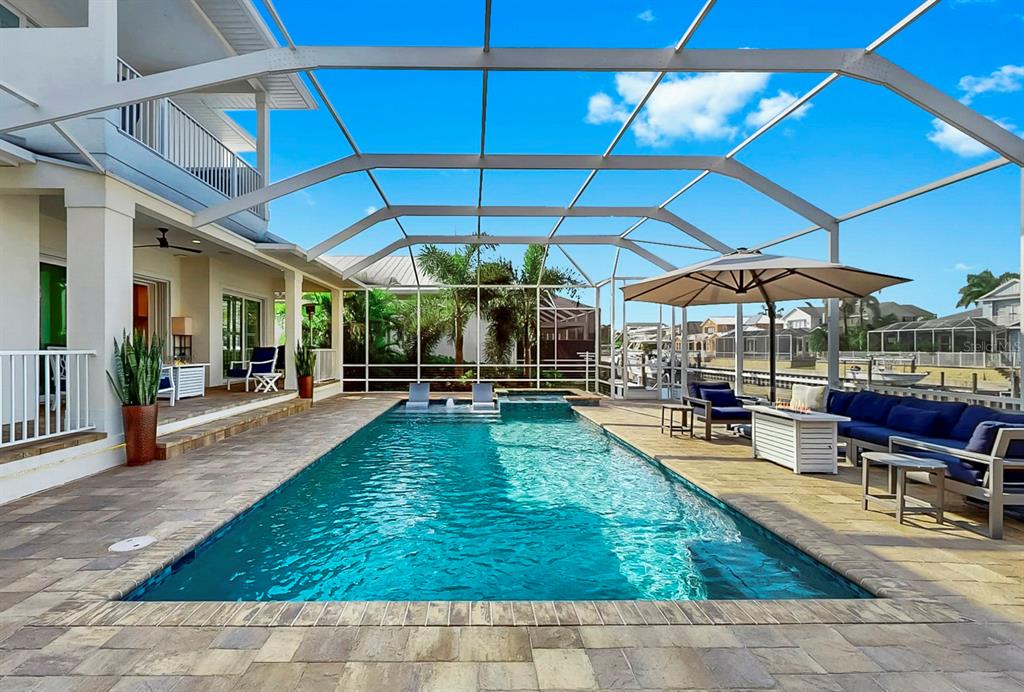 701 Pinckney Drive Apollo Beach, FL 33572 - Photo 62 of 99 a view of a swimming pool with a patio
