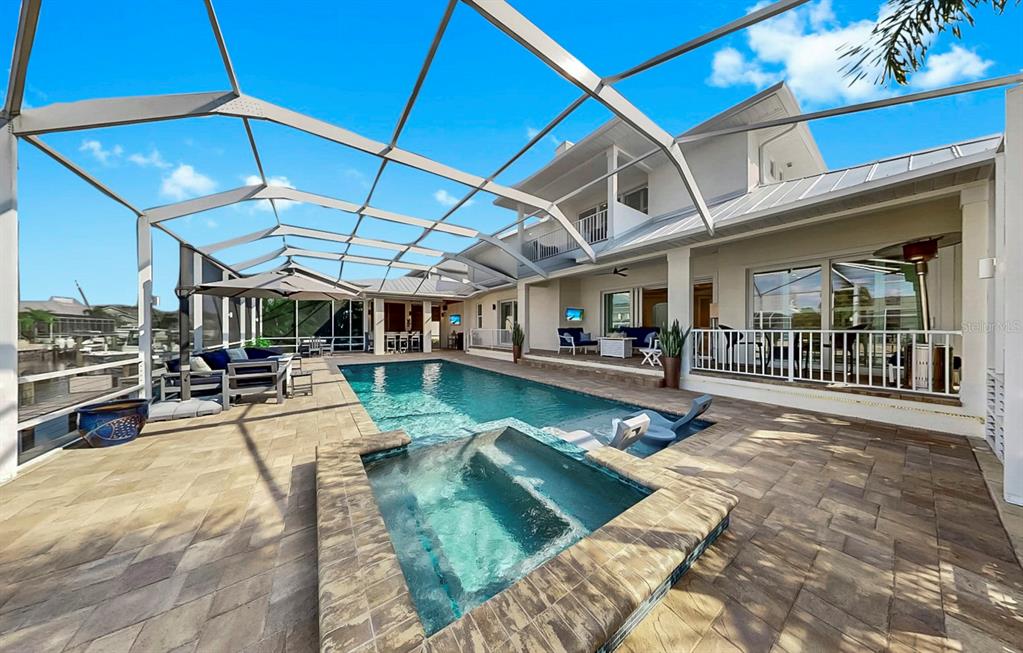 701 Pinckney Drive Apollo Beach, FL 33572 - Photo 64 of 99 a view of a swimming pool with sitting area