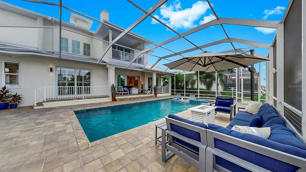701 Pinckney Drive Apollo Beach, FL 33572 - Photo 66 of 99 a view of a swimming pool with a patio
