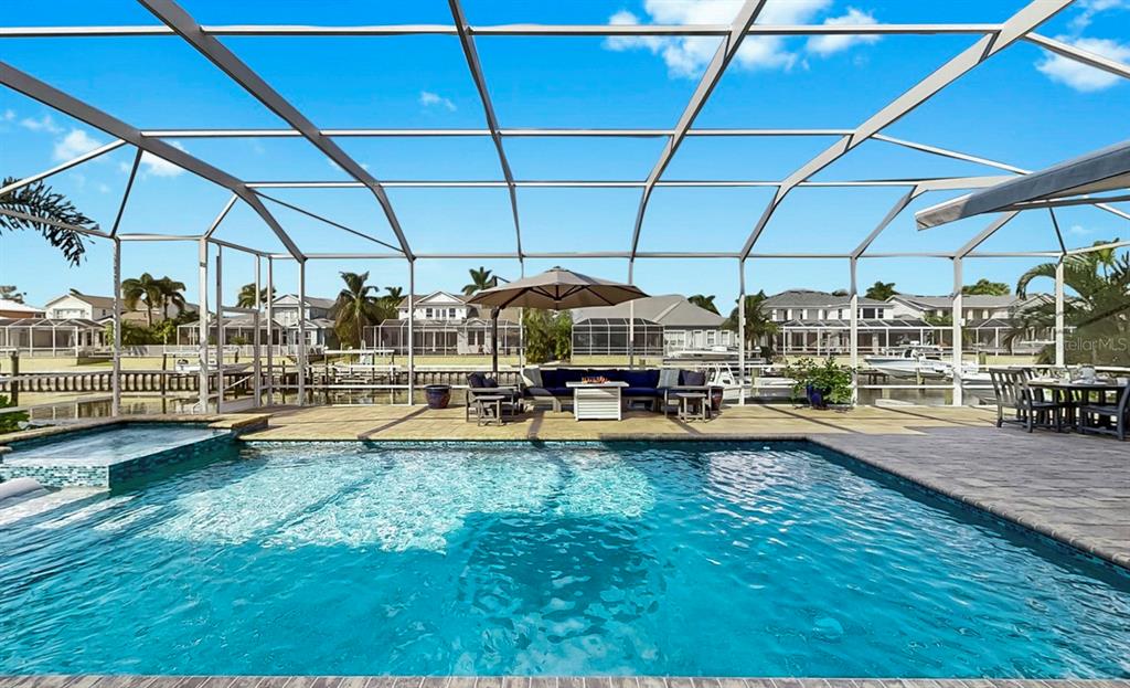 701 Pinckney Drive Apollo Beach, FL 33572 - Photo 70 of 99 a view of a swimming pool with a patio