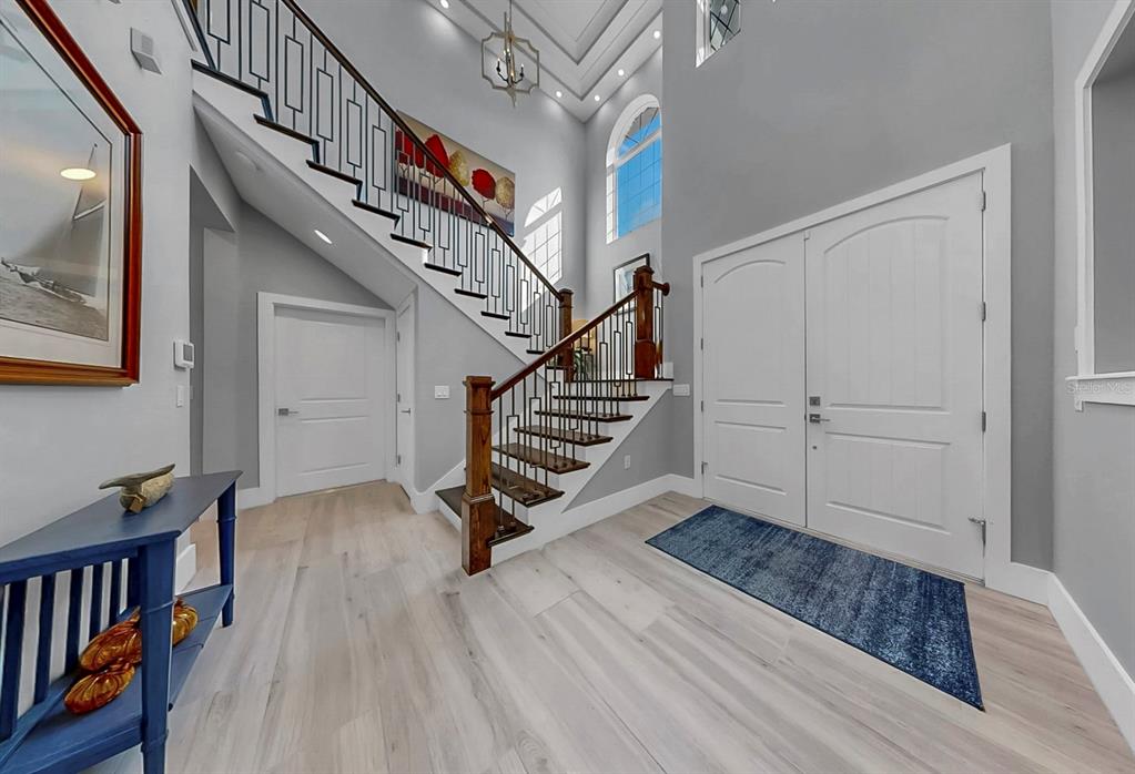 701 Pinckney Drive Apollo Beach, FL 33572 - Photo 8 of 99 a view of entryway with wooden floor and stairs